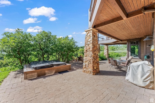 1355 W Red Hawk Trl Unit 35, Park City, UT 84098 - view of patio featuring outdoor dining area, a covered hot tub, and area for grilling