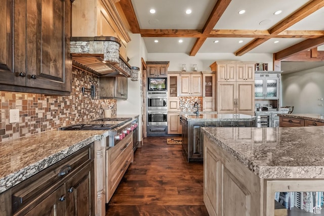 1355 W Red Hawk Trl Unit 35, Park City, UT 84098 - kitchen with beam ceiling, dark wood finished floors, stainless steel gas cooktop, a center island with sink, and black microwave