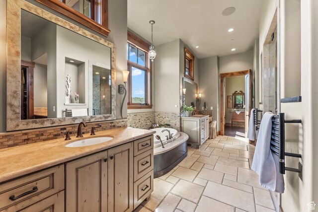 1355 W Red Hawk Trl Unit 35, Park City, UT 84098 - full bathroom with stone tile flooring, vanity, a bath, and decorative backsplash