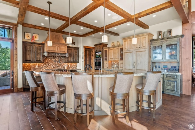 1355 W Red Hawk Trl Unit 35, Park City, UT 84098 - kitchen with dark wood-style flooring, a spacious island, decorative backsplash, stainless steel oven, and coffered ceiling