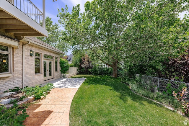 1387 E 260 N, Logan, UT 84321 - view of yard with a balcony, a patio, and french doors