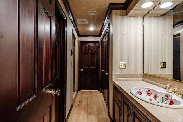 1387 E 260 N, Logan, UT 84321 - bathroom featuring hardwood / wood-style floors, vanity, and crown molding
