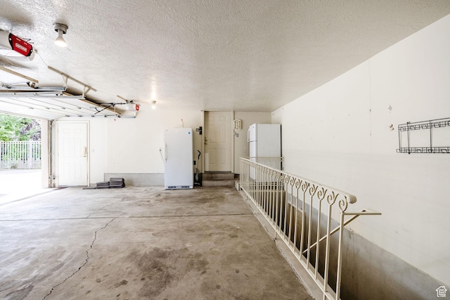 1387 E 260 N, Logan, UT 84321 - garage with white fridge and a garage door opener