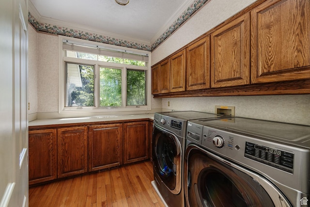 1387 E 260 N, Logan, UT 84321 - clothes washing area featuring cabinets, light wood-type flooring, washer and dryer, and crown molding