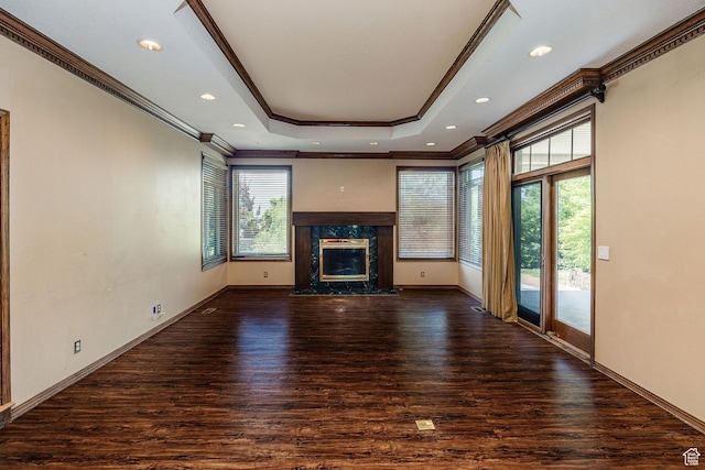 1387 E 260 N, Logan, UT 84321 - unfurnished living room with a raised ceiling, crown molding, a high end fireplace, and dark wood-type flooring