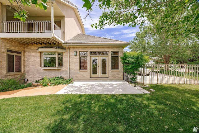 1387 E 260 N, Logan, UT 84321 - rear view of house with a balcony, a yard, and a patio