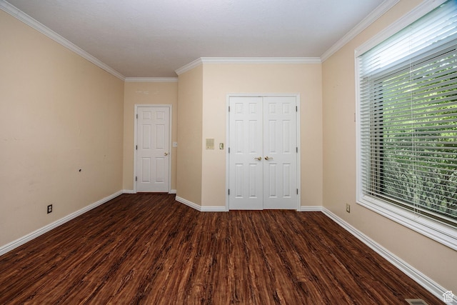 1387 E 260 N, Logan, UT 84321 - unfurnished bedroom featuring dark hardwood / wood-style floors, crown molding, and a closet