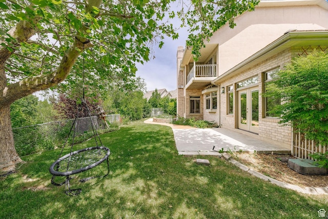 1387 E 260 N, Logan, UT 84321 - view of yard featuring french doors, a patio, and a balcony