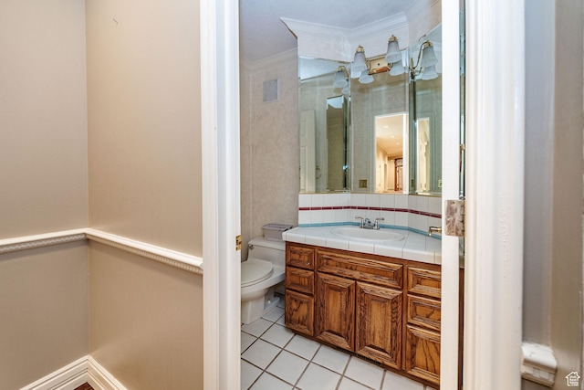 1387 E 260 N, Logan, UT 84321 - bathroom featuring vanity, tile patterned flooring, decorative backsplash, toilet, and ornamental molding