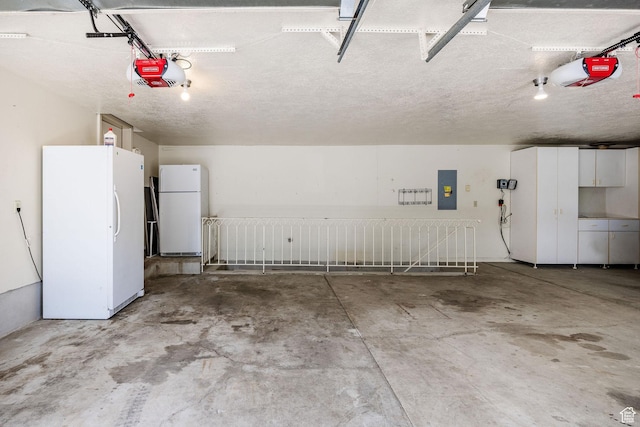 1387 E 260 N, Logan, UT 84321 - garage with electric panel, white fridge, and a garage door opener