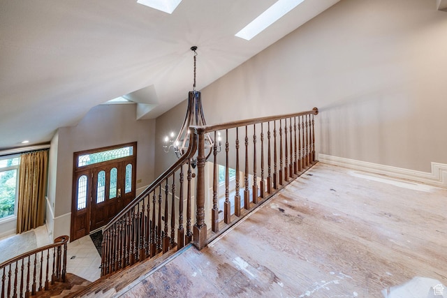 1387 E 260 N, Logan, UT 84321 - staircase featuring a chandelier and vaulted ceiling with skylight