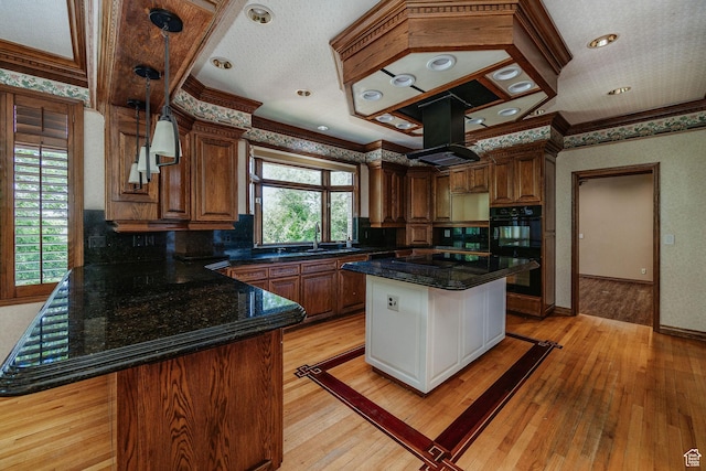 1387 E 260 N, Logan, UT 84321 - kitchen with light hardwood / wood-style flooring, a kitchen island, crown molding, and island range hood