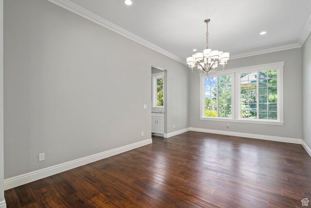3128 E Hunters Ridge Way, Heber City, UT 84032 - spare room featuring a chandelier, plenty of natural light, baseboards, dark wood-type flooring, and crown molding