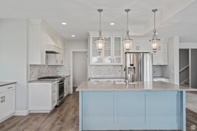 3128 E Hunters Ridge Way, Heber City, UT 84032 - kitchen with stainless steel appliances, backsplash, custom exhaust hood, glass insert cabinets, and recessed lighting