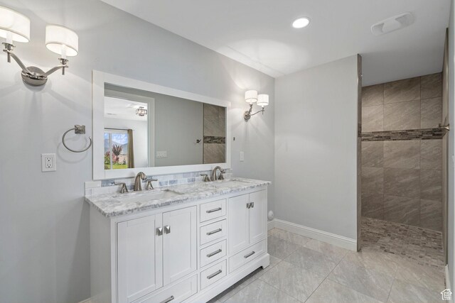 3128 E Hunters Ridge Way, Heber City, UT 84032 - bathroom featuring baseboards, double vanity, walk in shower, and recessed lighting