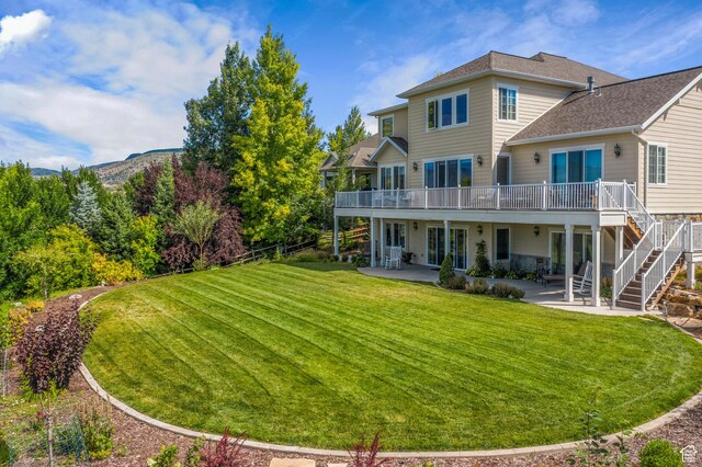 3128 E Hunters Ridge Way, Heber City, UT 84032 - back of house with a patio, a deck with mountain view, stairs, a yard, and french doors
