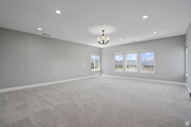 3128 E Hunters Ridge Way, Heber City, UT 84032 - empty room featuring a chandelier, recessed lighting, baseboards, and light colored carpet