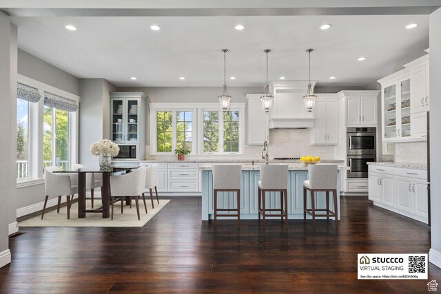 3128 E Hunters Ridge Way, Heber City, UT 84032 - kitchen featuring double oven, a center island with sink, decorative backsplash, white cabinetry, and recessed lighting