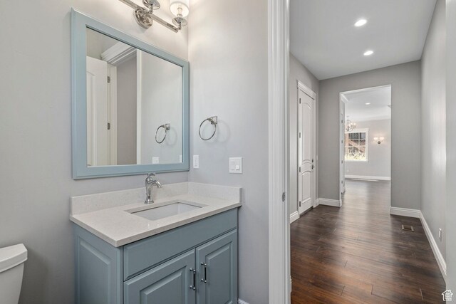 3128 E Hunters Ridge Way, Heber City, UT 84032 - bathroom with toilet, wood finished floors, recessed lighting, baseboards, and vanity