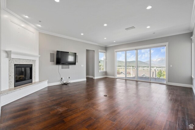 3128 E Hunters Ridge Way, Heber City, UT 84032 - unfurnished living room with baseboards, dark wood-style floors, a premium fireplace, ornamental molding, and recessed lighting