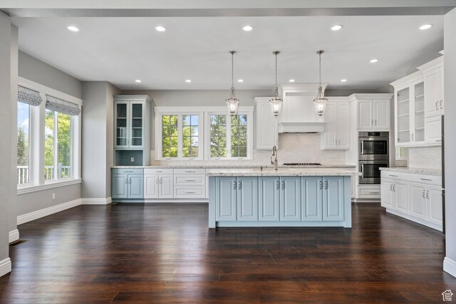 3128 E Hunters Ridge Way, Heber City, UT 84032 - kitchen featuring double oven, white cabinets, backsplash, a center island with sink, and recessed lighting