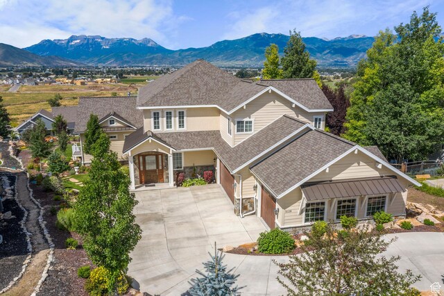 3128 E Hunters Ridge Way, Heber City, UT 84032 - traditional home featuring concrete driveway, stone siding, roof with shingles, and a mountain view