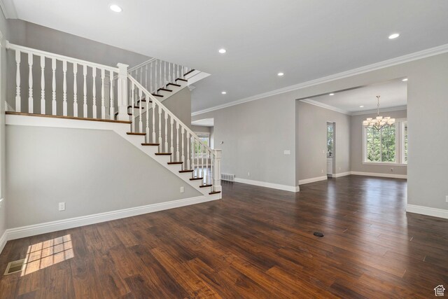 3128 E Hunters Ridge Way, Heber City, UT 84032 - unfurnished living room with a chandelier, wood finished floors, stairway, baseboards, and crown molding