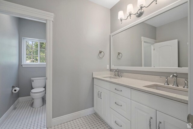 3128 E Hunters Ridge Way, Heber City, UT 84032 - full bathroom with baseboards, toilet, double vanity, and tile patterned floors