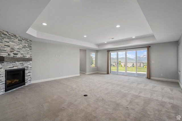 3128 E Hunters Ridge Way, Heber City, UT 84032 - unfurnished living room with a raised ceiling, light carpet, baseboards, and recessed lighting