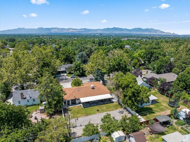 birds eye view of property with a mountain view