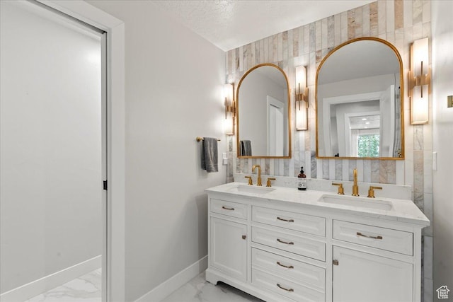 bathroom featuring vanity and a textured ceiling