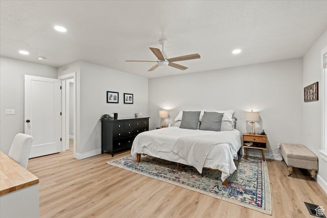 bedroom featuring wood-type flooring and ceiling fan