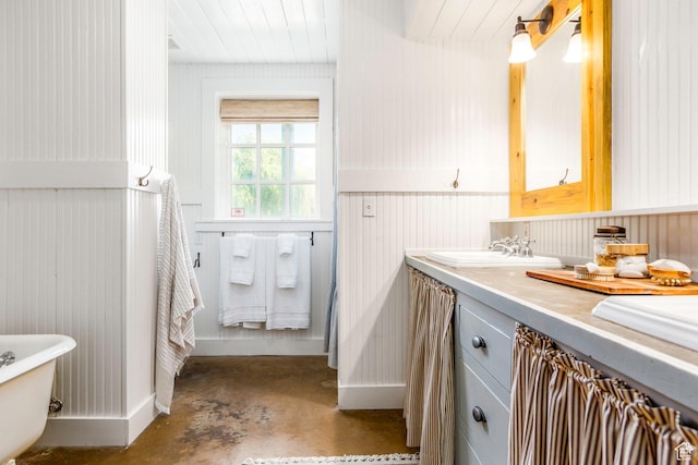 1380 S Mills Ln, Heber City, UT 84032 - bathroom featuring concrete flooring, a freestanding tub, wood walls, vanity, and wooden ceiling