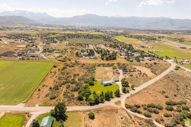 birds eye view of property with a mountain view