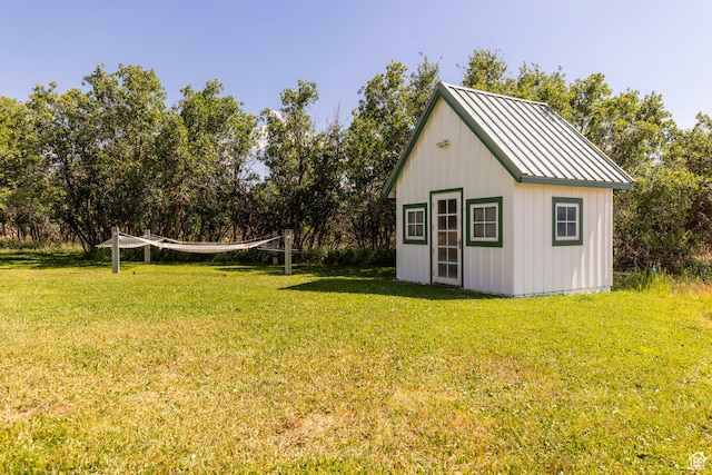 view of shed / structure with a lawn