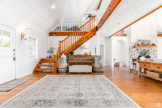 entryway with ceiling fan, hardwood / wood-style flooring, and lofted ceiling