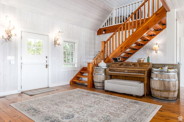 entryway with lofted ceiling and hardwood / wood-style flooring