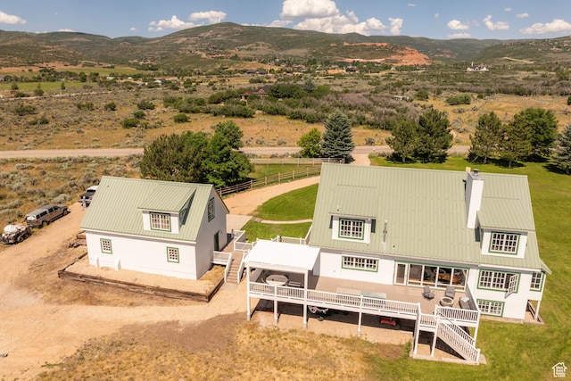 drone / aerial view featuring a mountain view