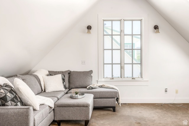 carpeted living room featuring lofted ceiling