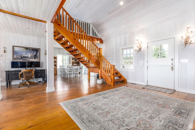 foyer entrance featuring a healthy amount of sunlight and wood-type flooring