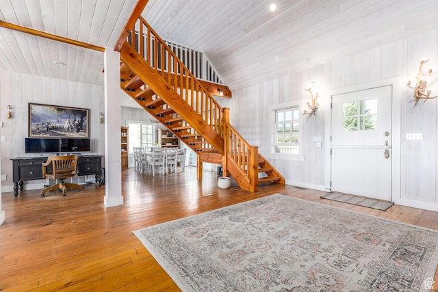 1380 S Mills Ln, Heber City, UT 84032 - foyer entrance featuring stairway, lofted ceiling, hardwood / wood-style flooring, wood walls, and wooden ceiling