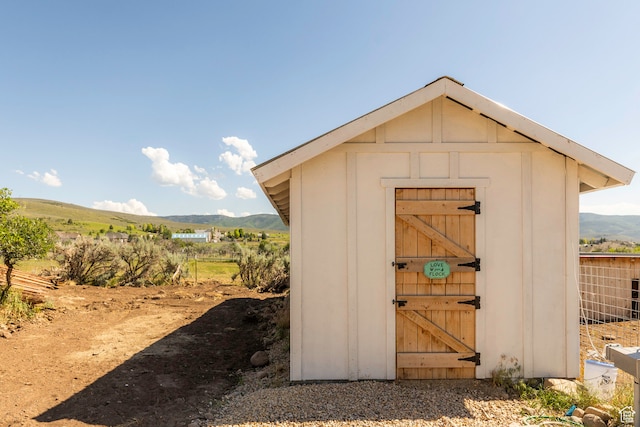 view of shed / structure with a mountain view