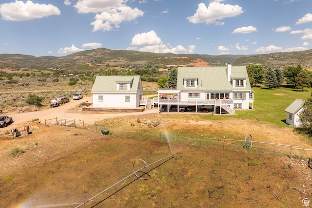 birds eye view of property with a rural view and a mountain view