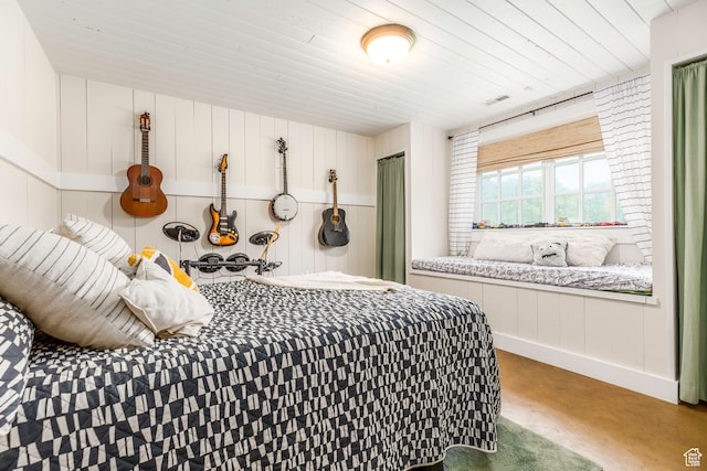 bedroom featuring concrete floors