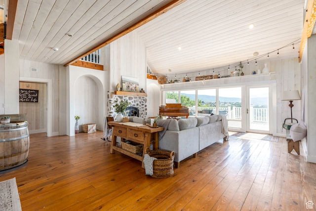 living room with high vaulted ceiling, wood-type flooring, wood ceiling, and rail lighting