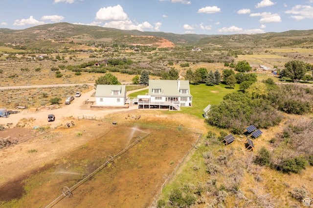drone / aerial view with a mountain view and a rural view