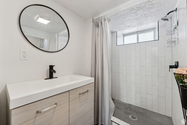 2977 S 8950 W, Magna, UT 84044 - bathroom featuring a shower with shower curtain, a textured ceiling, and vanity