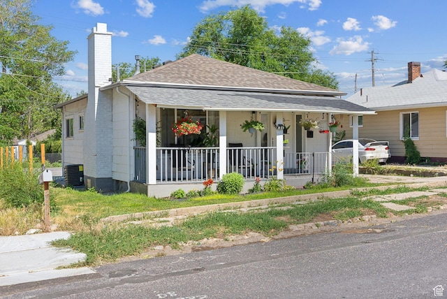 2977 S 8950 W, Magna, UT 84044 - view of front of home featuring central AC unit and covered porch