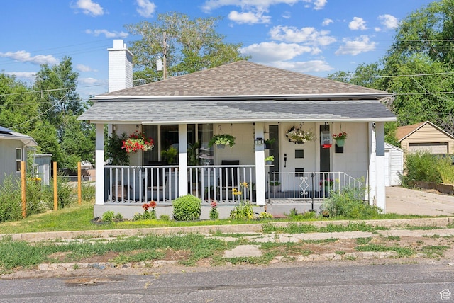 2977 S 8950 W, Magna, UT 84044 - view of front of home featuring a porch and a garage