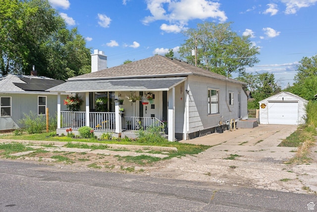 2977 S 8950 W, Magna, UT 84044 - view of front of house featuring an outbuilding, a porch, and a garage